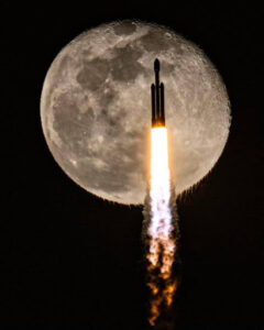 rocket launching with full moon in the background